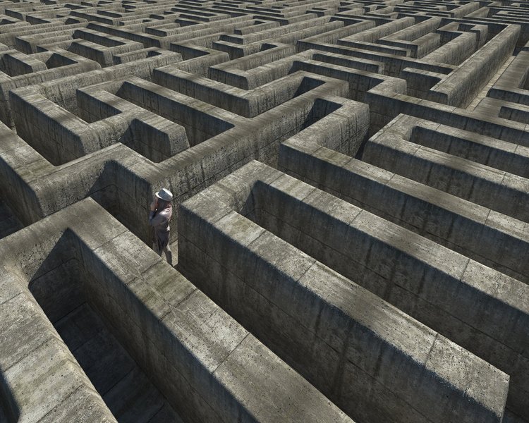 Labyrinth mit einer Person, die nach einem Ausweg sucht.